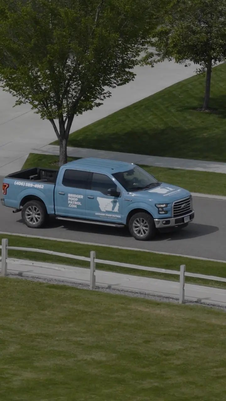 The Bridger Poop Patrol truck pulling up to a house